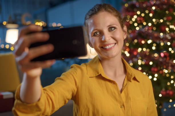 istock Woman taking selfies at Christmas 1344267009
