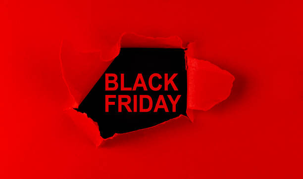 istock Red torn paper and the inscription black friday on a black background. 1344268110