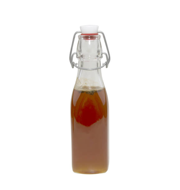 istock bottle of honey isolated on white background 1344268905