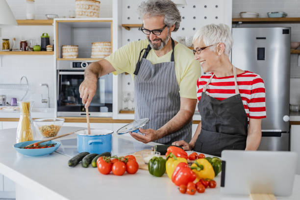 istock Senior couple tastes new recipes 1344270543