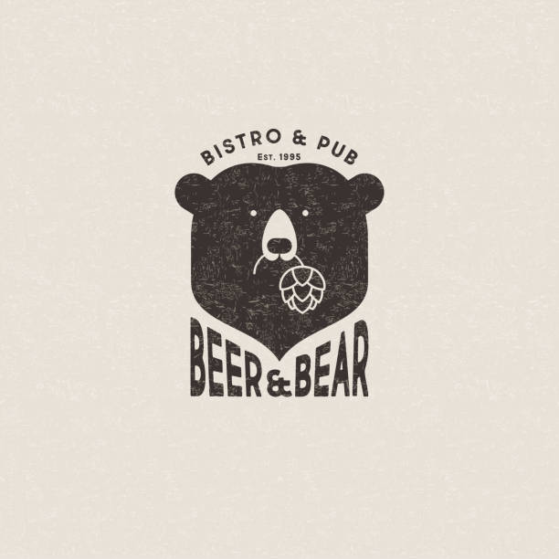 bier und bären emblem. der kopf von bär und buchstaben. bär hält hopfenzapfen. - businessbear stock-grafiken, -clipart, -cartoons und -symbole