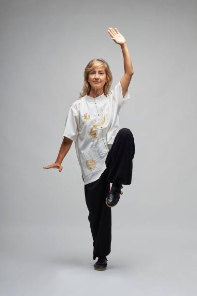 istock Mature blonde woman practicing Tai Chi 1344273237