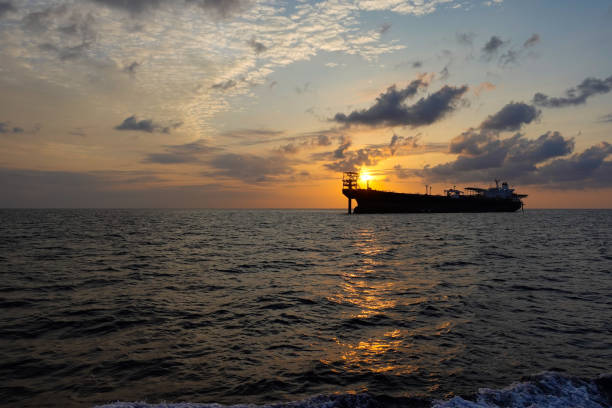 oil storage vessel tank floating in gulf ,beautiful sunrise view. - oil tanker tanker oil sea imagens e fotografias de stock