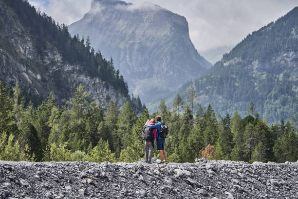 istock Friends hike down forested trail in the morning 1344281535
