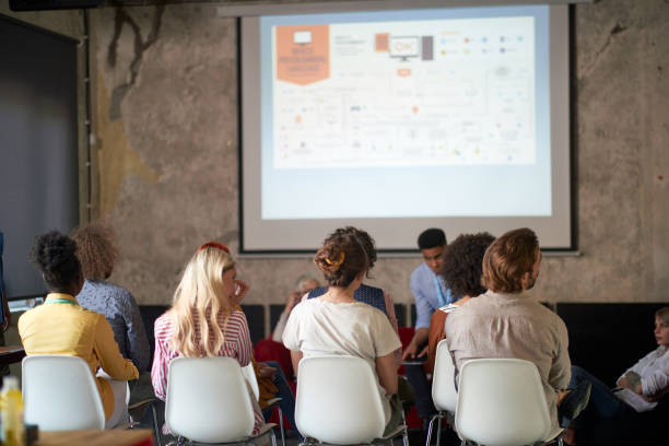 istock Group of young creative employees at presentation in the office 1344282619