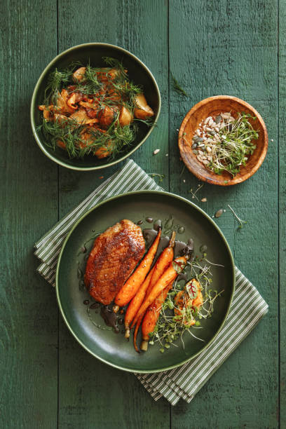 istock Roast duck breast with vegetables 1344282693