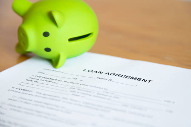 istock Loan agreement and piggy bank 1344285477