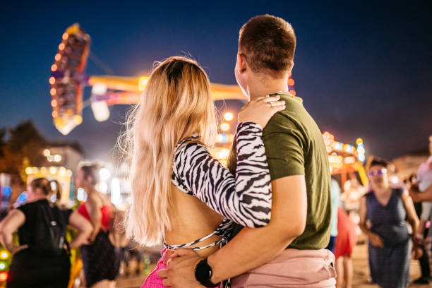 istock Young couple in amusement park 1344289458