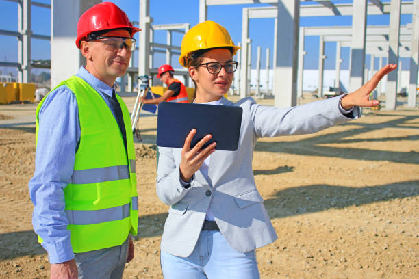 istock Group of builders and architect in hardhats 1344290593