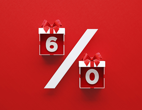 White gift boxes tied with red ribbon forming a percentage sign on red background. Horizontal composition with copy space. Directly above. Great use for Christmas and Valentine's Day related gift concepts.
