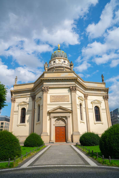 istock Path leading to traditional style building with brass dome and gold statue 1344295565