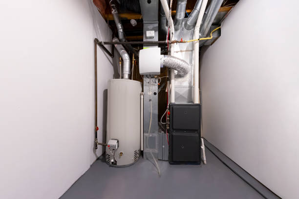 A home high efficiency furnace. Furnace Dual Stage Electronically Commutated Motors A home high efficiency furnace. Furnace Dual Stage Electronically Commutated Motors. Motor Upflow/Horizontal Furnace Multi-Speed Two-Stage Energy efficient, a humidifier and a water heater. furnace stock pictures, royalty-free photos & images
