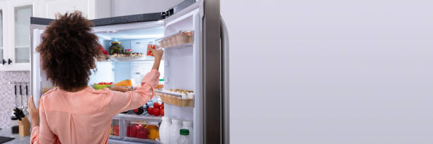 istock Woman Taking Food From Refrigerator 1344305258