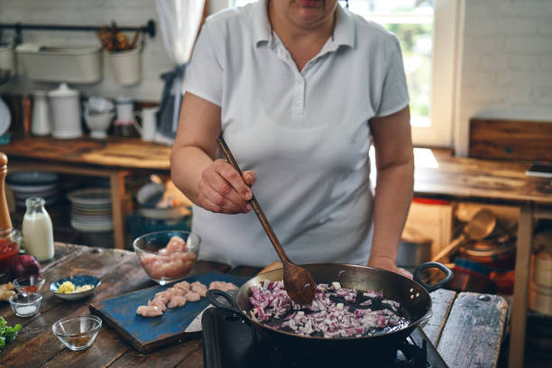 istock Preparing Indian Chicken Curry with Naan Bread and Pappadom 1344307250