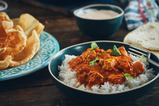 istock Indian Chicken Curry with Naan Bread and Poppadum 1344307320