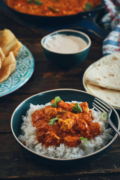 Indian Chicken Curry with Naan Bread and Poppadum Indian Chicken Curry with Naan Bread and Poppadum chicken curry stock pictures, royalty-free photos & images