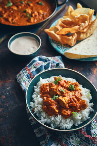 istock Indian Chicken Curry with Naan Bread and Poppadum 1344307331