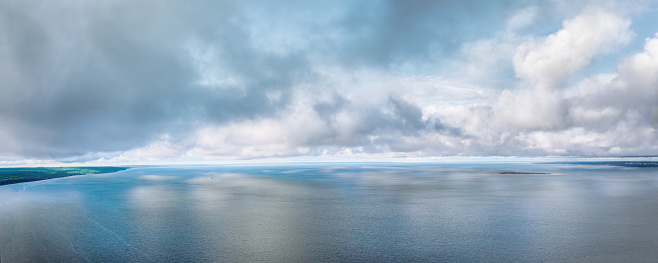 Dramatic clouds over Volga river, Russia. Large and wide aerial panoramic view