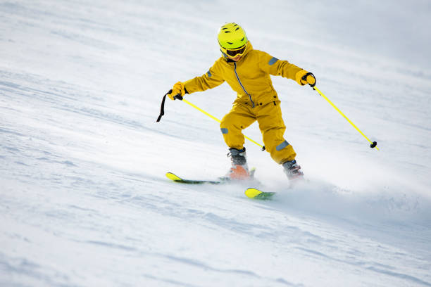 istock Little boy skiing in mountains 1344309529