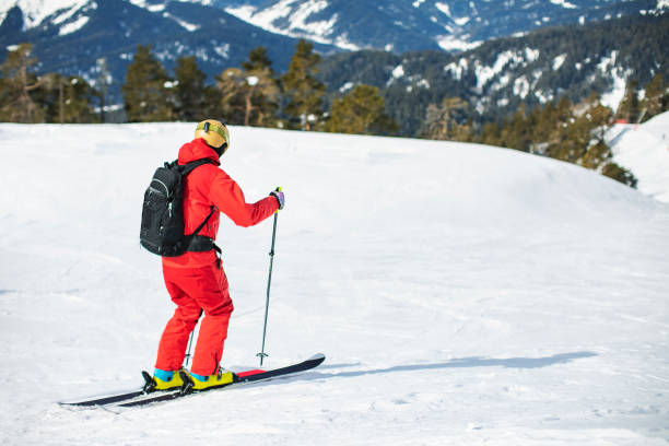 istock Young adult man skiing in mountains alone 1344309583