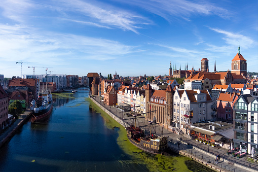 The classic view of Gdansk Old Town with historical  ships on the River Motlawa, Poland