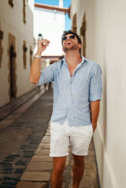 istock Happy male tourist looking up 1344310640