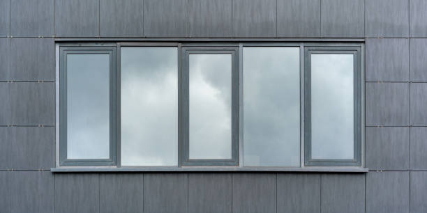 istock stylish windows reflect sky with fluffy white clouds 1344310833