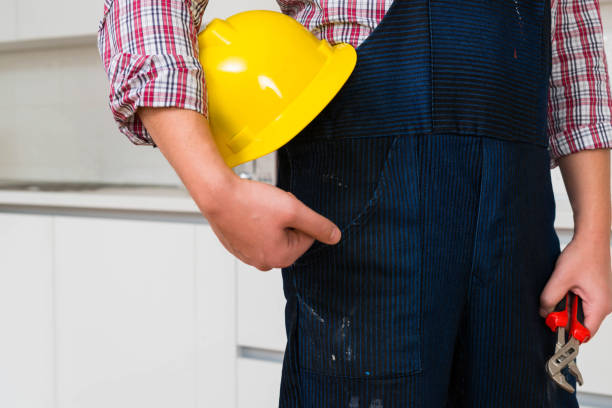 istock Repairman In Overalls In Kitchen 1344313002