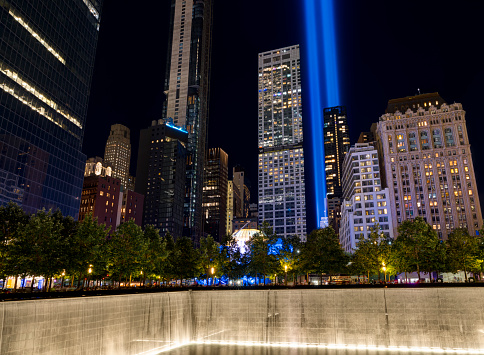 New York, USA - September 11, 2021:    Tribute in Light. Lower Manhattan illuminated at night. Memorial South Pool. View from Ground Zero, Manhattan.