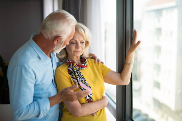 istock Supportive senior man talking with his depressed wife during Covid-19 quarantine. 1344317938