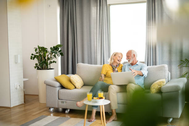 istock Happy senior couple using electronic banking at home. 1344317981