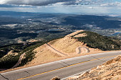 Pikes Peak mountain range in Colorado in the fall on a cloudy day.