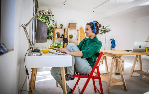 istock Smiling woman working from home 1344322431