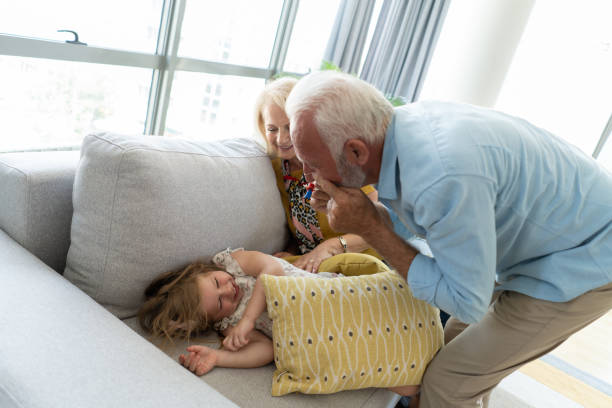 istock Happy senior man playing with his granddaughter. 1344323496