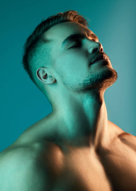 istock Studio shot of a handsome young man posing against a blue background 1344323901