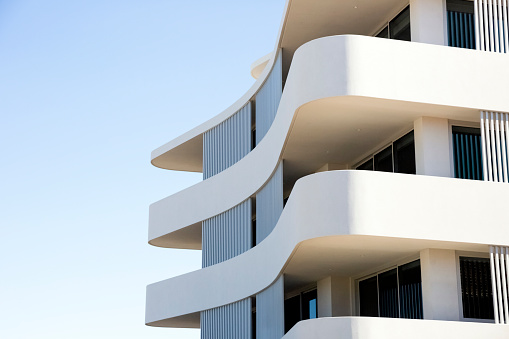 Closeup new modern apartment building, Sydney Australia, sky background with copy space, full frame horizontal composition