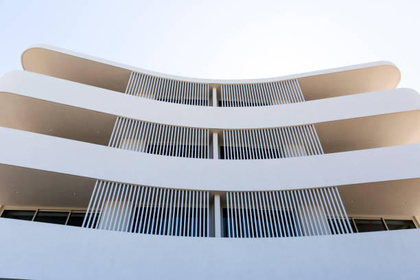 istock Closeup new, modern apartment building, front view, sky background with copy space 1344330835