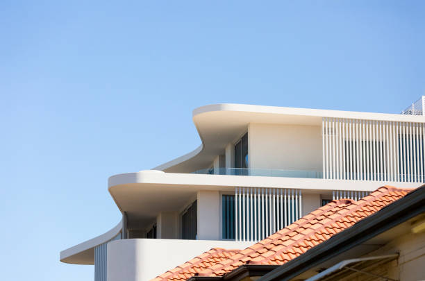 Closeup new, modern apartment building, sky background with copy space