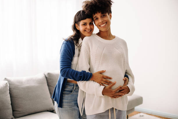 istock Cheerful pregnant couple smiling at the camera 1344335877