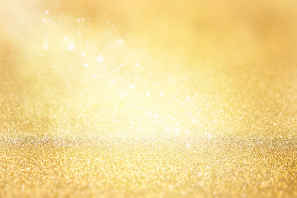 istock Golden glitter background. Abstract Christmas background with bokeh and defocused lights. 1344336549