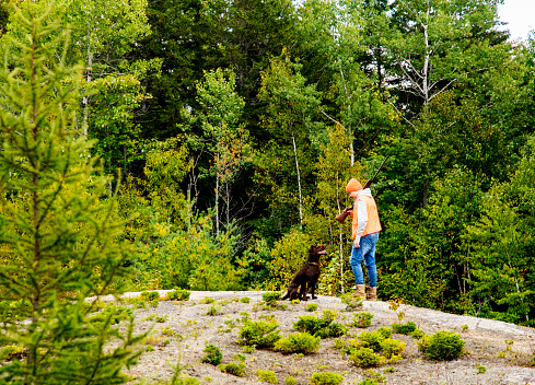 A teen hunter with his Labrador Retriever