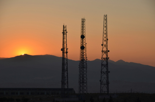 Sunset and communication towers
