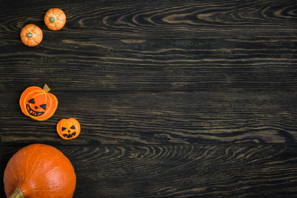 istock Halloween background with pumpkin and cookies 1344338934