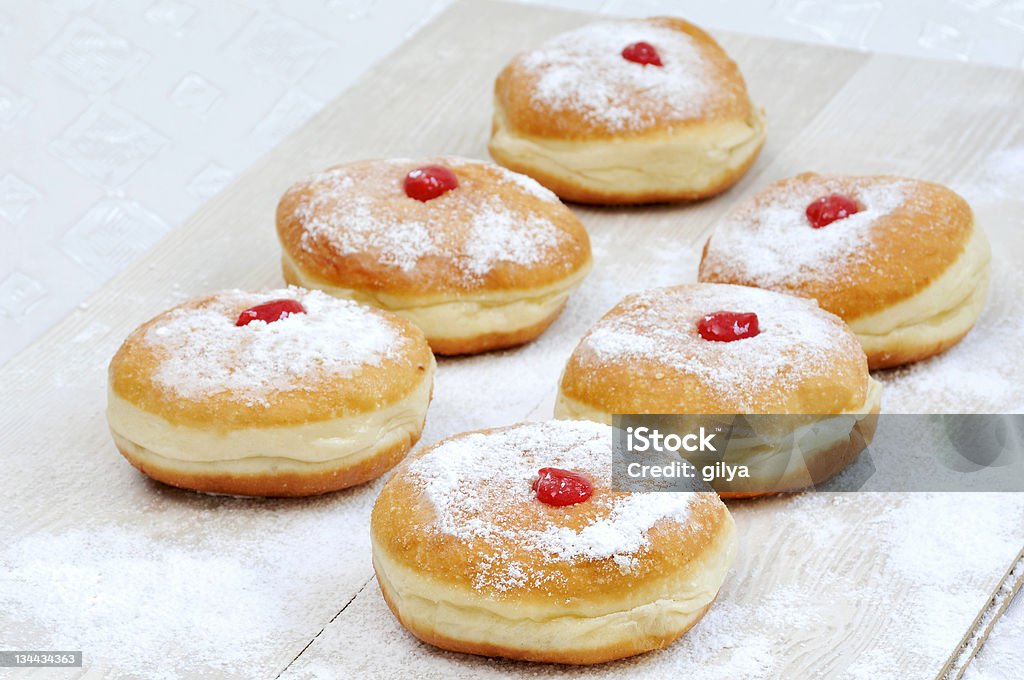 Hanukah doughnuts, sufganiya Hanukkah doughnut with jam and Powdered sugar Jelly Doughnut Stock Photo