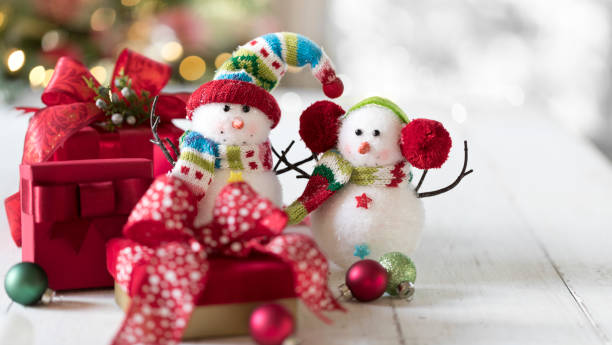 istock Snowman and Christmas Gifts 1344347721