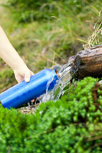 istock Water bottle and stream on hike 134434897