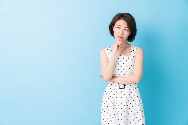 istock attractive asian woman who thinks 1344350636