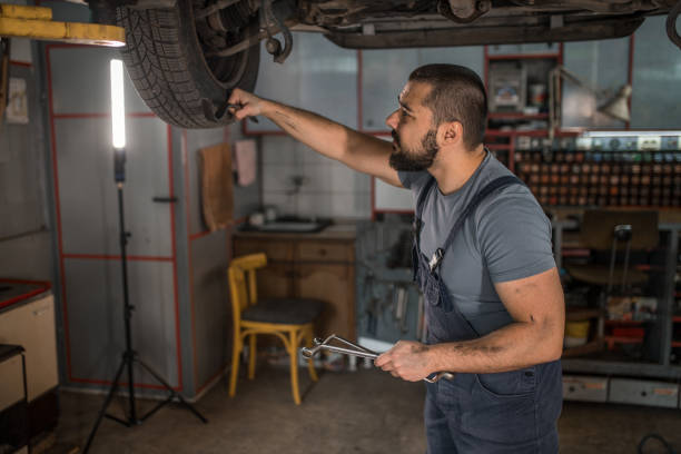 istock Young mechanic fixing malfunction on the wheel 1344354573