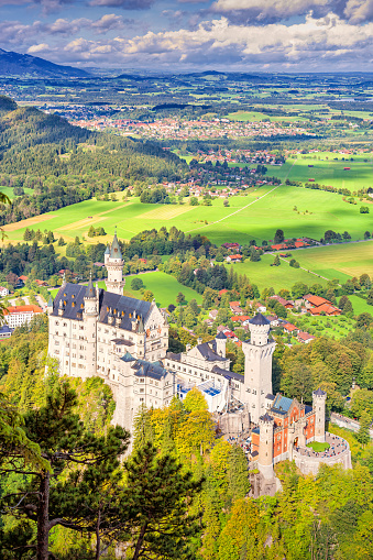 Neuschwanstein Castle in Schwangau, Bavaria, Germany as seen from above on a sunny day