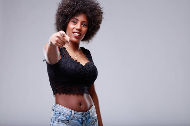 istock Young Black woman pointing towards the camera 1344357764